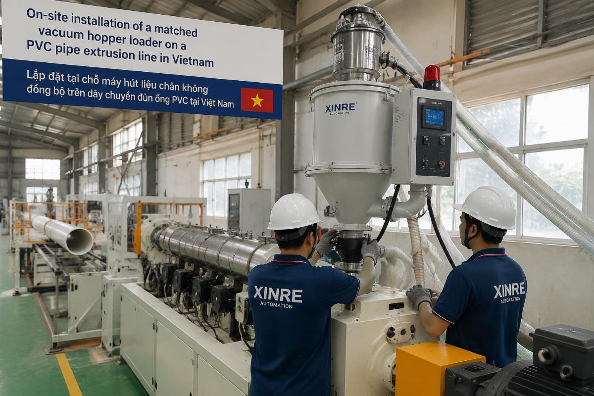 On-site installation of a matched vacuum hopper loader on a PVC pipe extrusion line in Vietnam